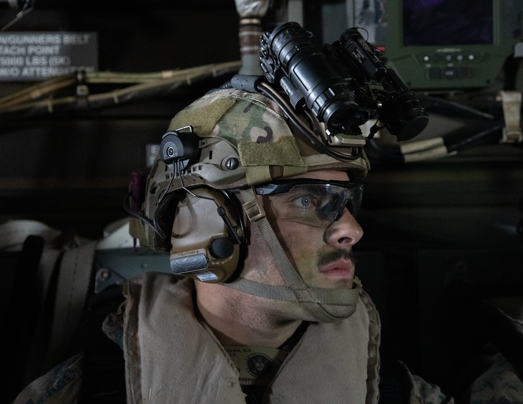 U.S. Marine Corps Lance Cpl. Scott Peirson with Battalion Landing Team 1/8, 24th Marine Expeditionary Unit (MEU), rides in a U.S. Marine Corps MV-22B Osprey with Marine Medium Tiltrotor Squadron 36 (Reinforced) for a simulated Tactical Recovery of Aircraft and Personnel mission during Composite Training Unit Exercise (COMPTUEX) over the Atlantic Ocean, April 24, 2024. The 24th MEU and Wasp (WSP) Amphibious Ready Group (ARG) are conducting COMPTUEX, their final at-sea, certification exercise under the evaluation of Carrier Strike Group 4 and Expeditionary Operations Training Group. Throughout COMPTUEX, the WSP ARG-24th MEU is evaluated across a spectrum of scenarios that determine their readiness to deploy. (U.S. Marine Corps photo by Cpl. Aydan Millette)