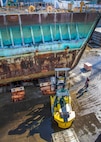 Old Caisson 3 sits in Dry dock 3 at Puget Sound Naval Shipyard and Intermediate Facility in Bremerton, Washington, Sept. 27, 2019. Project team members from Shops 11, 17 and 75 are using a 'cold-cutting' technique during the caisson dismantling and recycling project. (U.S. Navy photo by Wendy Hallmark)