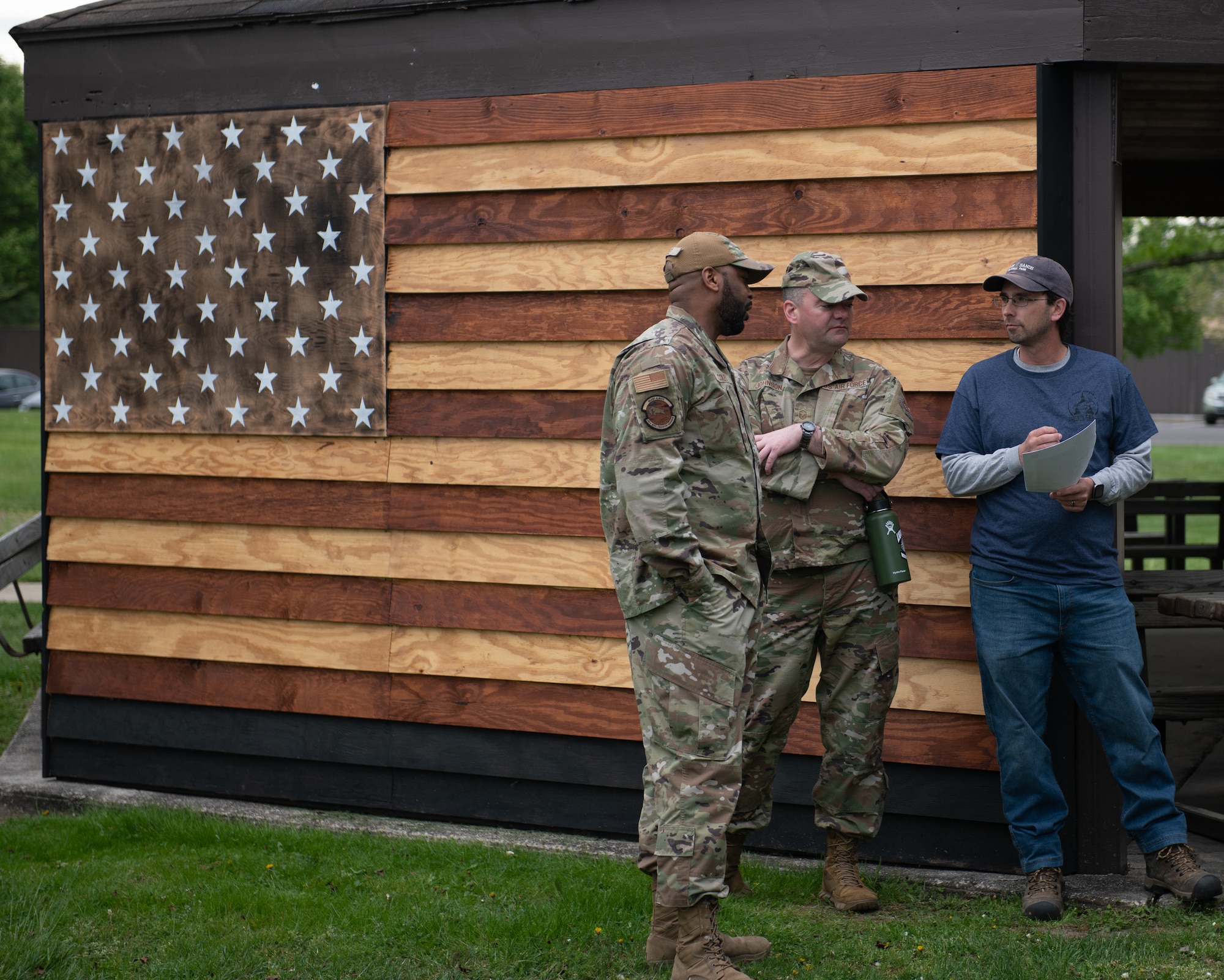 Jeffrey Wenck, Petroleum, Oils, and Lubricants program manager, instructs two Airmen on the base wide cleanup procedures.