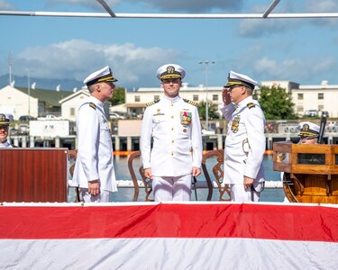 JOINT BASE PEARL HARBOR-HICKAM (Jan. 25, 2024) — Cmdr. Christopher Clevenger, incoming commanding officer of the Los Angeles-class fast-attack submarine USS Topeka (SSN 754), right, relieves Cmdr. James Fulks, outgoing commanding officer of Topeka, during the change of command ceremony for the Topeka on Joint Base Pearl Harbor-Hickam, Hawaii, Jan. 25, 2024. Topeka, commissioned Oct. 21, 1989, is the third ship of the United States Navy named for the city of Topeka, Kan., and is the fourth “improved” Los Angeles-class submarine.  (U.S. Navy photo by Mass Communication Specialist 1st Class Scott Barnes)