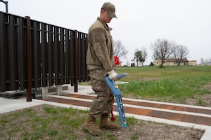 U.S. Air Force A1C Ethan Welsh, 509th Civil Engineering Electric, electrical systems apprentice locates an underground electric cable at Whiteman Air Force Base, Mo., March 26, 2024. CE Airmen are using Radiodetection RD7200 locators to survey underground cables rather than contracting surveys, reducing dig permit cost from $3,236 to $160. (U.S. Air Force photo by Senior Airman Joseph Garcia)