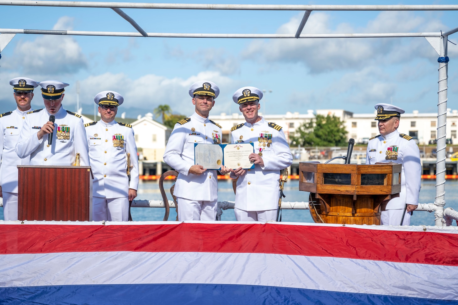 JOINT BASE PEARL HARBOR-HICKAM (Jan. 25, 2024) — Cmdr. James Fulks, outgoing commanding officer of the Los Angeles-class fast-attack submarine USS Topeka (SSN 754), right, poses for a photo with Capt. David Cox, commander, Submarine Squadron Seven, after receiving a Meritorious Service Medal during the change of command ceremony for the Topeka on Joint Base Pearl Harbor-Hickam, Hawaii, Jan. 25, 2024. Topeka, commissioned Oct. 21, 1989, is the third ship of the United States Navy named for the city of Topeka, Kan., and is the fourth “improved” Los Angeles-class submarine.  (U.S. Navy photo by Mass Communication Specialist 1st Class Scott Barnes)