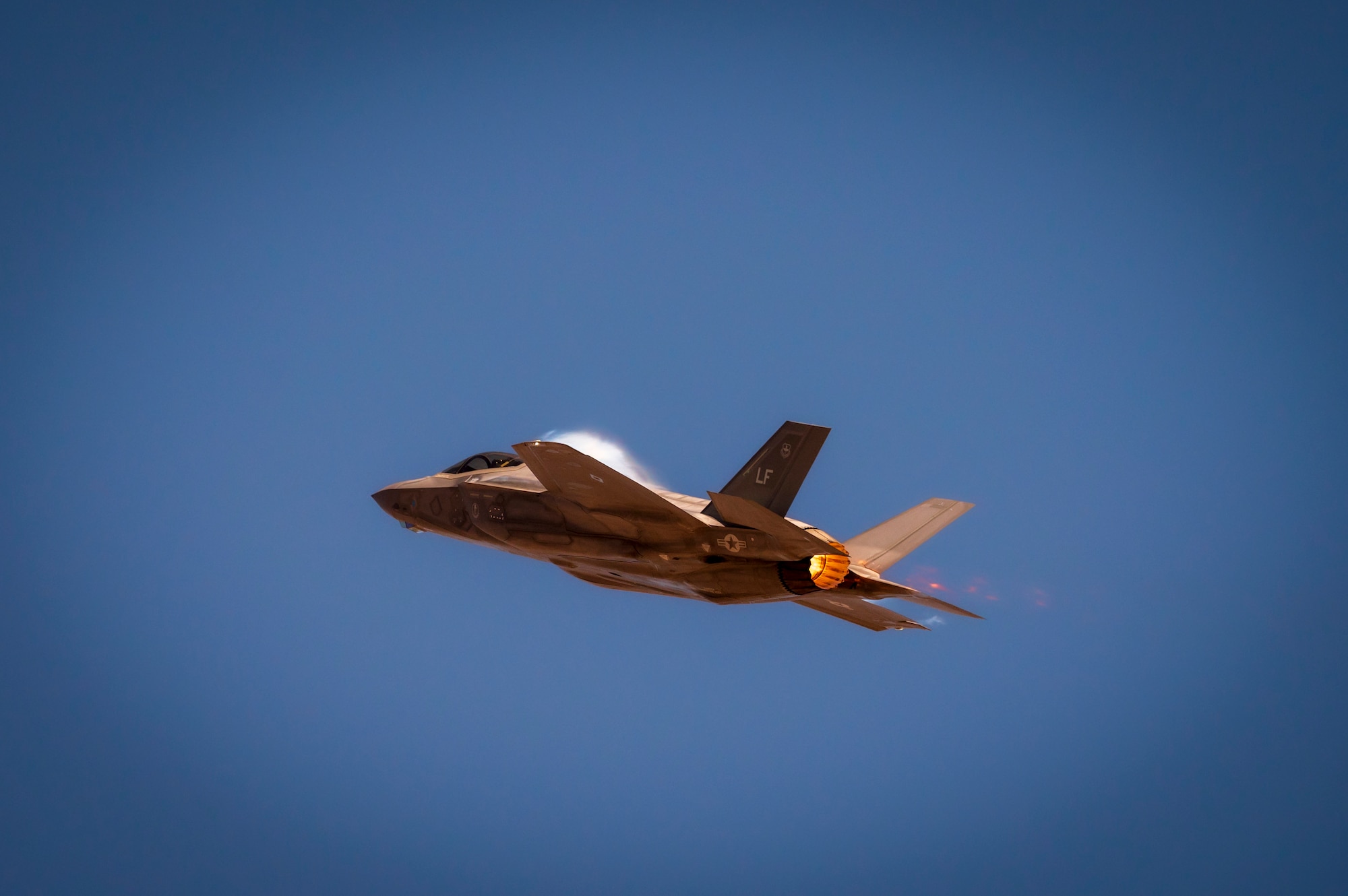 A U.S. Air Force F-35 Lightning II assigned to the 56th Fighter Wing, Luke Air Force Base, Arizona, performs a strafing run during Haboob Havoc 2024, April 24, 2024, at Barry M. Goldwater Range, Arizona.