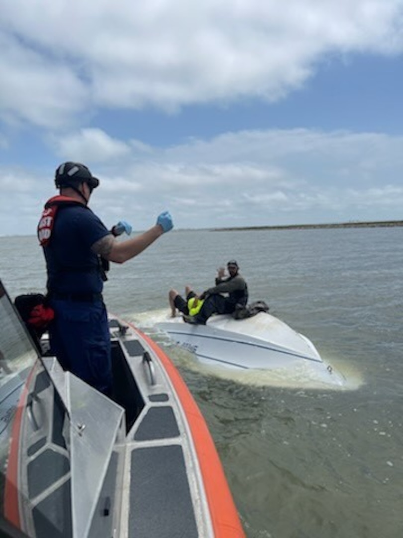 A Coast Guard Station Galveston boat crew rescues two from their capsized boat near Texas City, Texas on April 29, 2024. The boat crew embarked the two people and transferred them to their friend's vessel. (Photo Courtesy Coast Guard Station Galveston)