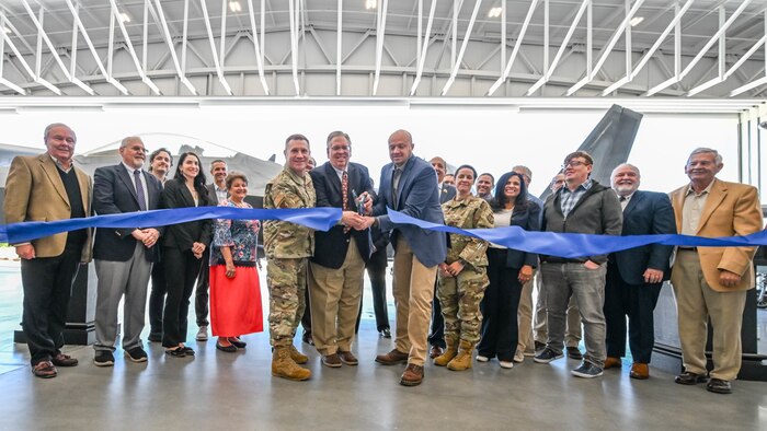 (Center) Col. Jeffrey Holland, 75th Air Base Wing commander, Robb Alexander, executive director of the Aerospace Heritage Foundation of Utah, and Aaron Clark, Hill Aerospace Museum director, cut the ribbon during a ceremony commemorating the opening of the new L.S. Skaggs Gallery at the Hill Aerospace Museum at Hill Air Force Base, Utah, April 29, 2024. The new gallery is a 91,000 square foot hangar and provides a 70% increase to the indoor exhibition space. (U.S. Air Force photo by Cynthia Griggs)