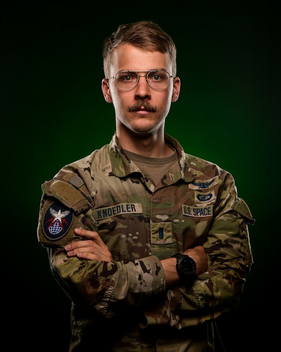 1st Lt. Knoedler poses as the focus of the Down to Earth feature.