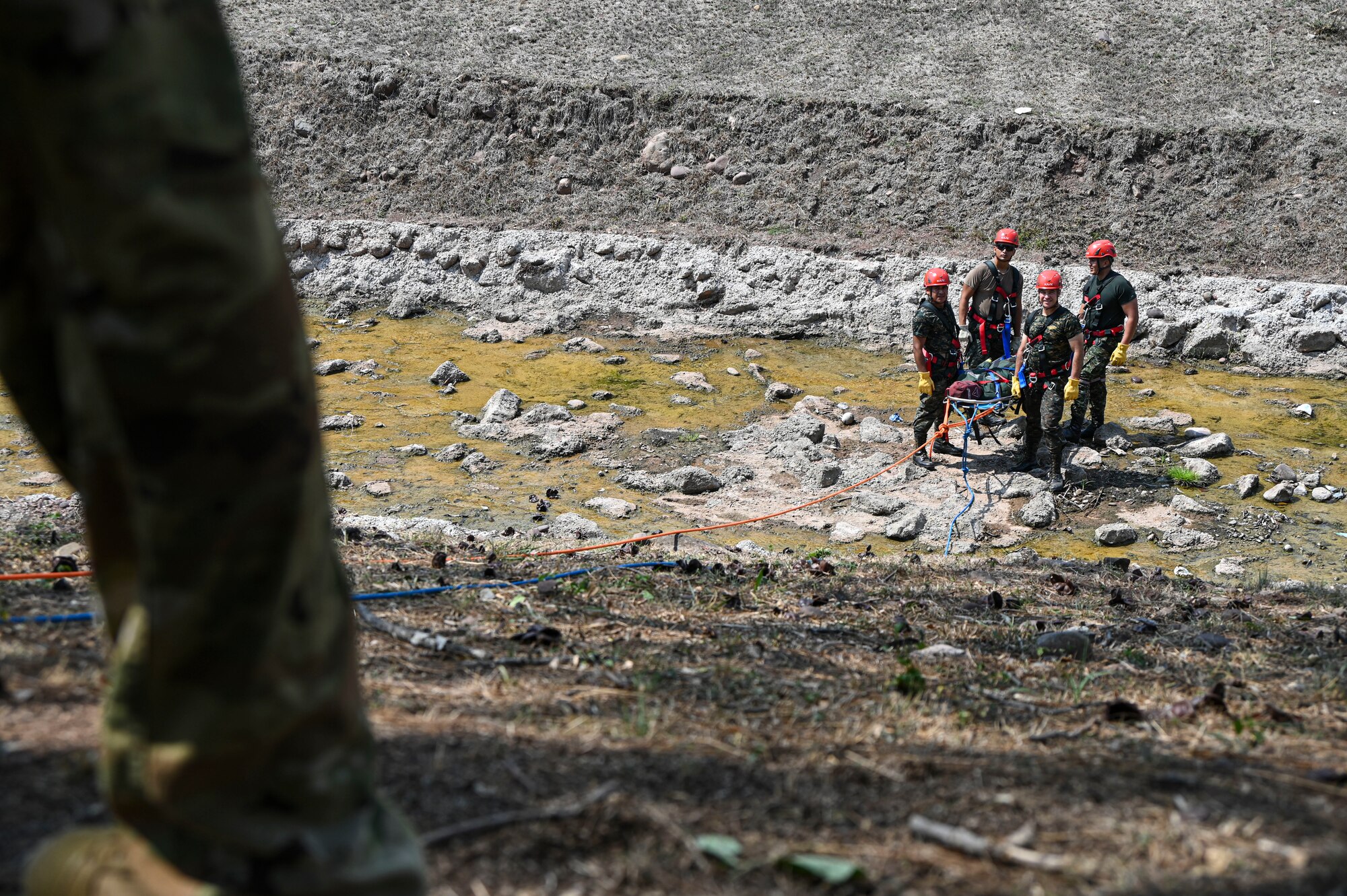 A photo of service members working together.