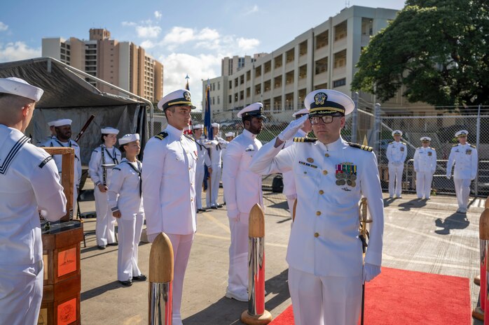JOINT BASE PEARL HARBOR-HICKAM (Jan. 25, 2024) Cmdr. Christopher Clevenger, incoming commanding officer of the Los Angeles-class fast-attack submarine USS Topeka (SSN 754), arrives at the change of command ceremony for the Topeka on Joint Base Pearl Harbor-Hickam, Hawaii, Jan. 25, 2024. Topeka, commissioned Oct. 21, 1989, is the third ship of the United States Navy named for the city of Topeka, Kan., and is the fourth “improved” Los Angeles-class submarine.  (U.S. Navy photo by Mass Communication Specialist 1st Class Scott Barnes)