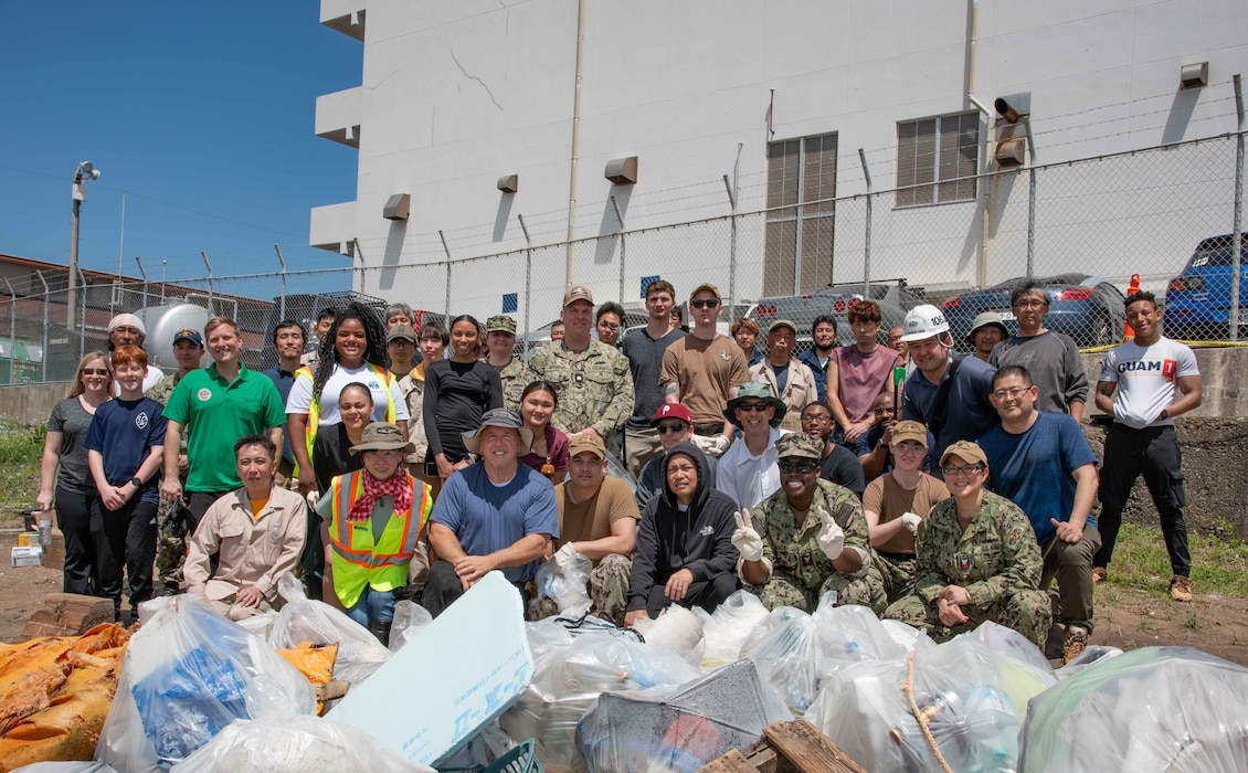 Participants of a beach cleanup event as part of Earth Day observance onboard Commander, Fleet Activities Yokosuka pose for a photo. More than 40 Sailors, civilians and Japanese employees across the command cleaned up the beach behind the Navy Exchange Yokosuka’s warehouse.