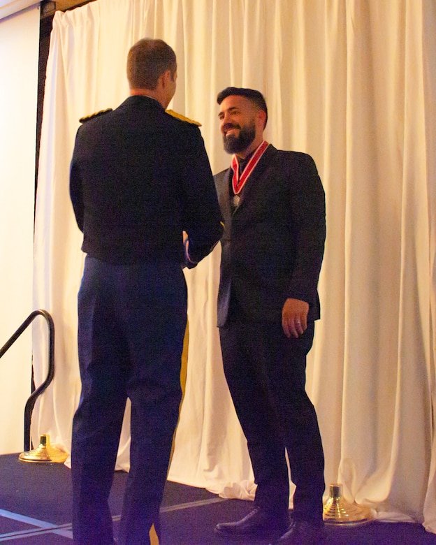 Albuquerque District Commander Lt. Col. Jerre Hansbrough presents the Steel de Fleury Medal to Joshua Ellison, civil engineer in the district's Technical Support Branch, Operations Division, during the Albuquerque District Ball, Feb. 17, 2024, in Albuquerque, N.M.