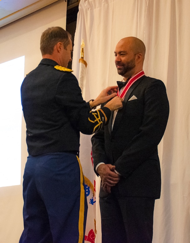 Albuquerque District Commander Lt. Col. Jerre Hansbrough presents the Steel de Fleury Medal to Christian (Jake) Goldsmith, Office of Counsel, during the Albuquerque District Ball, Feb. 17, 2024, in Albuquerque, N.M.