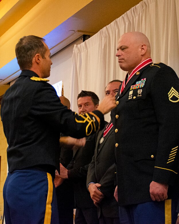 Albuquerque District Commander Lt. Col. Jerre Hansbrough, left, presents the Steel de Fleury Medal to Staff Sgt. Richard Howard, contracting officer in the district’s Contracting Division, during the Albuquerque District Ball, Feb. 17, 2024, in Albuquerque, N.M.