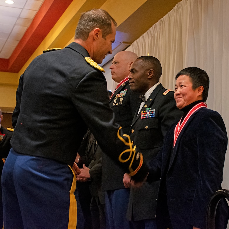 Albuquerque District Commander Lt. Col. Jerre Hansbrough presents the Steel de Fleury Medal to Ellis Ho, civil engineer in the district’s Structural Unit, Facilities Design Section, during the Albuquerque District Ball, Feb. 17, 2024, in Albuquerque, N.M.