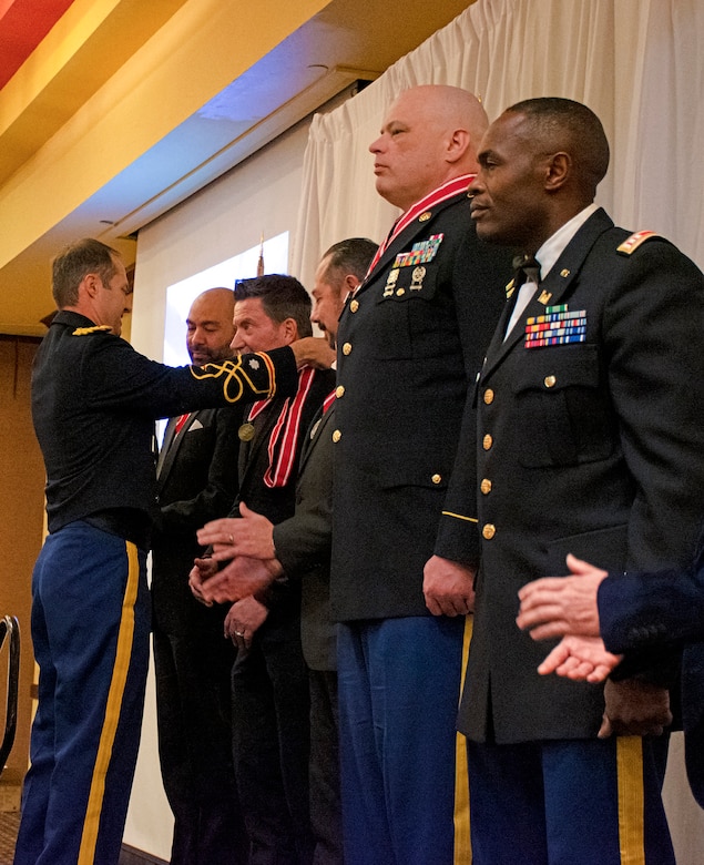 Albuquerque District Commander Lt. Col. Jerre Hansbrough presents the Bronze de Fleury Medal to Gregory Allen, quality manager/management analyst in the district’s Resource Management Office, during the Albuquerque District Ball, Feb. 17, 2024, in Albuquerque, N.M.