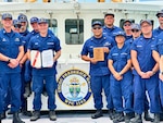 A portion of the crew of the USCGC Frederick Hatch (WPC 1143) stands for a photo on March 14, 2024, in Santa Rita, Guam. In January 2024, the Surface Navy Association National Symposium in Washington, D.C., was marked by the commendation of the USCGC Frederick Hatch (WPC 1143) crew as the recipient of the prestigious 2023 Hopley Yeaton Cutter Excellence Award (Small). This accolade recognizes operational efficiency and pays tribute to the spirit of pioneering leadership and maritime governance that defines the U.S. Coast Guard. (U.S. Coast Guard photo by Chief Warrant Officer Sara Muir)