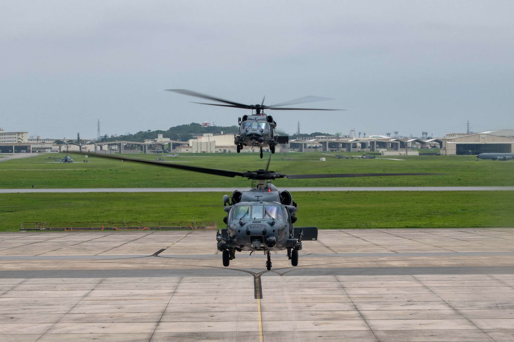Two U.S. Air Force HH-60G Pave Hawks hover in position for a formation.