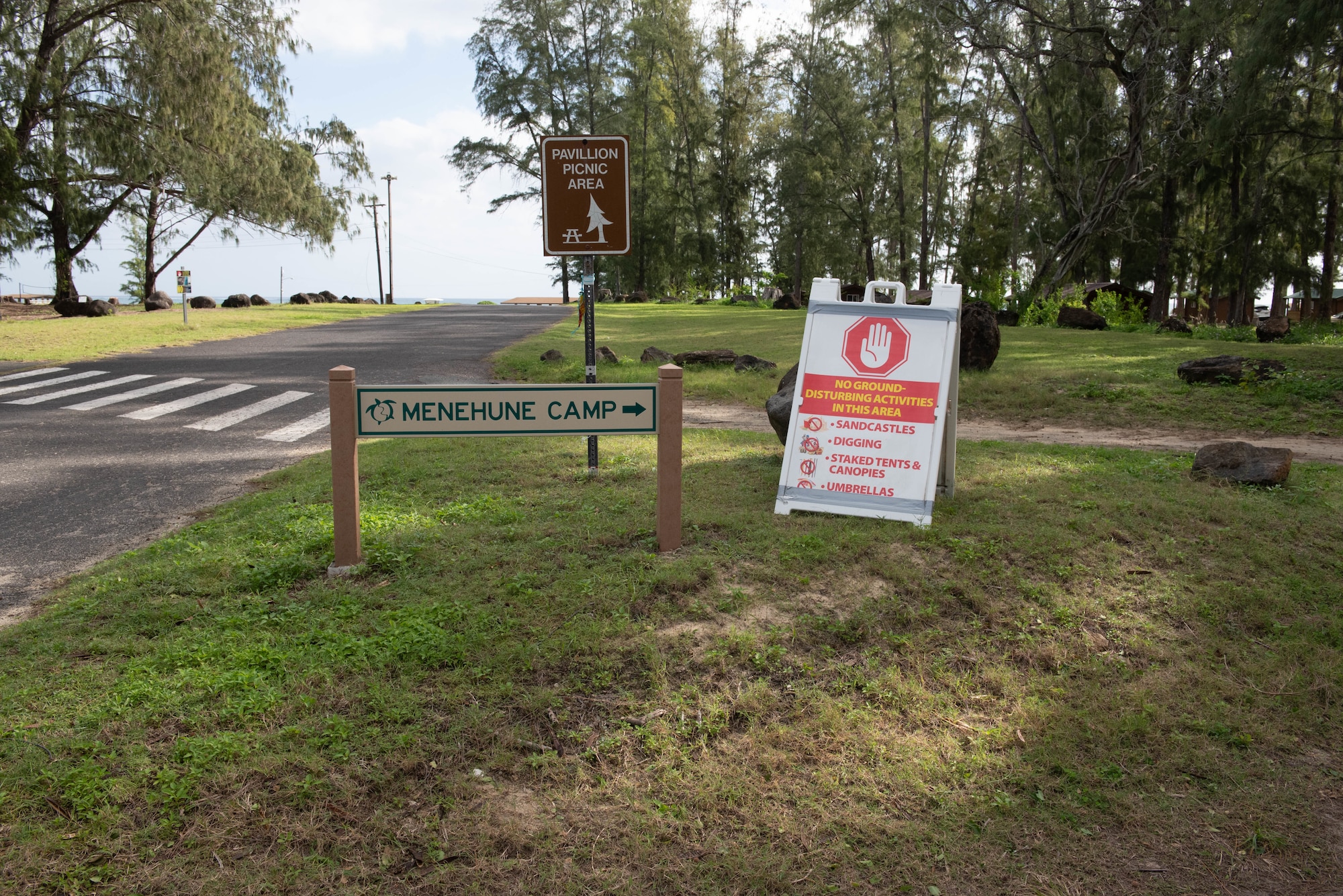 A photo of three signs at Bellows Air Force Station.