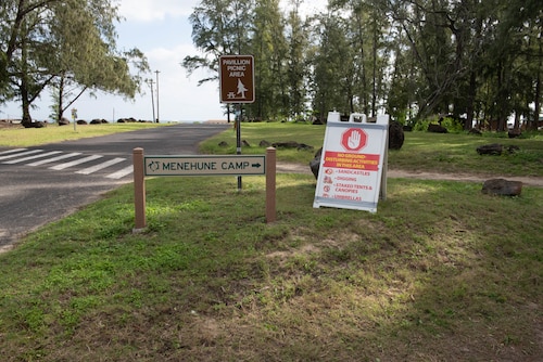 A photo of three signs at Bellows Air Force Station.