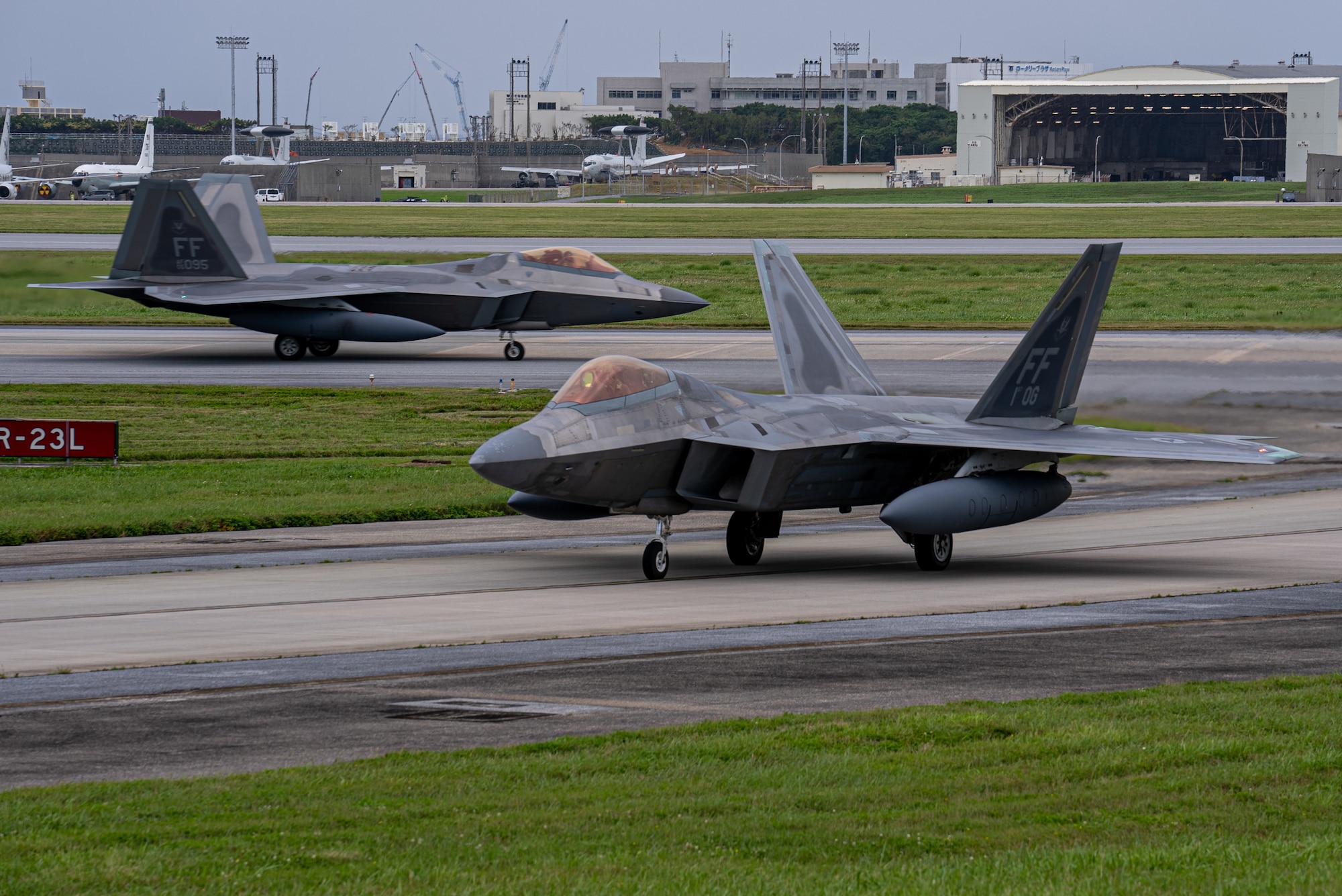 U.S. F-22A Raptors assigned to the 27th Fighter Squadron taxi away from the runway at Kadena Air Base, Japan, April 20, 2024. As the 18th Wing continues the phased return of Kadena’s fleet of F-15C/D Eagles, the Department of Defense will maintain a steady-state fighter presence in the Indo-Pacific region by temporarily deploying aircraft to maintain deterrence capabilities and added flexibility in a dynamic theater. (U.S. Air Force photo by Senior Airman Cedrique Oldaker)