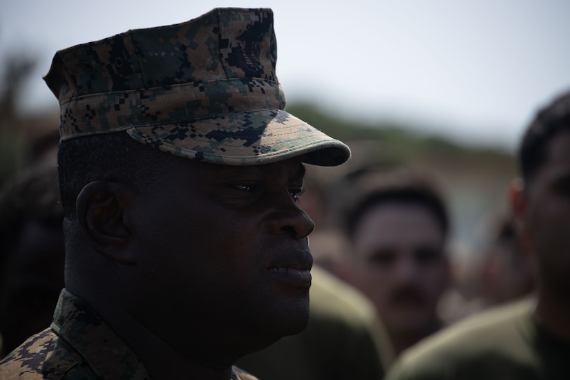 A close-up of a Marine in a crowd.