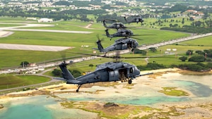 U.S. Air Force HH-60G Pave Hawks assigned to the 33rd Rescue Squadron fly in formation over Kadena Air Base, Japan, April 16, 2024.
