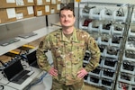 man stands in computer work area