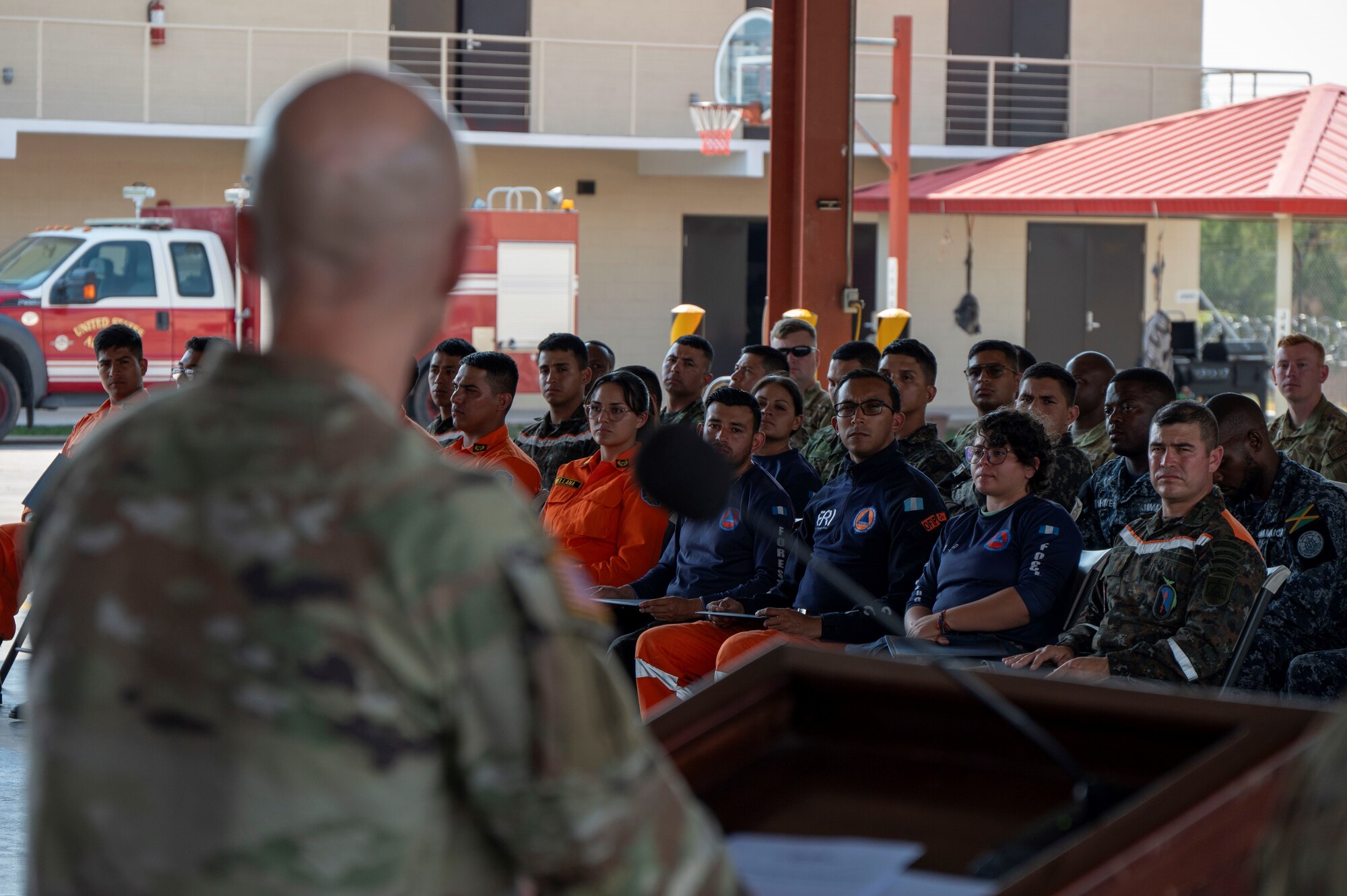 A photo of a service member giving a speech.