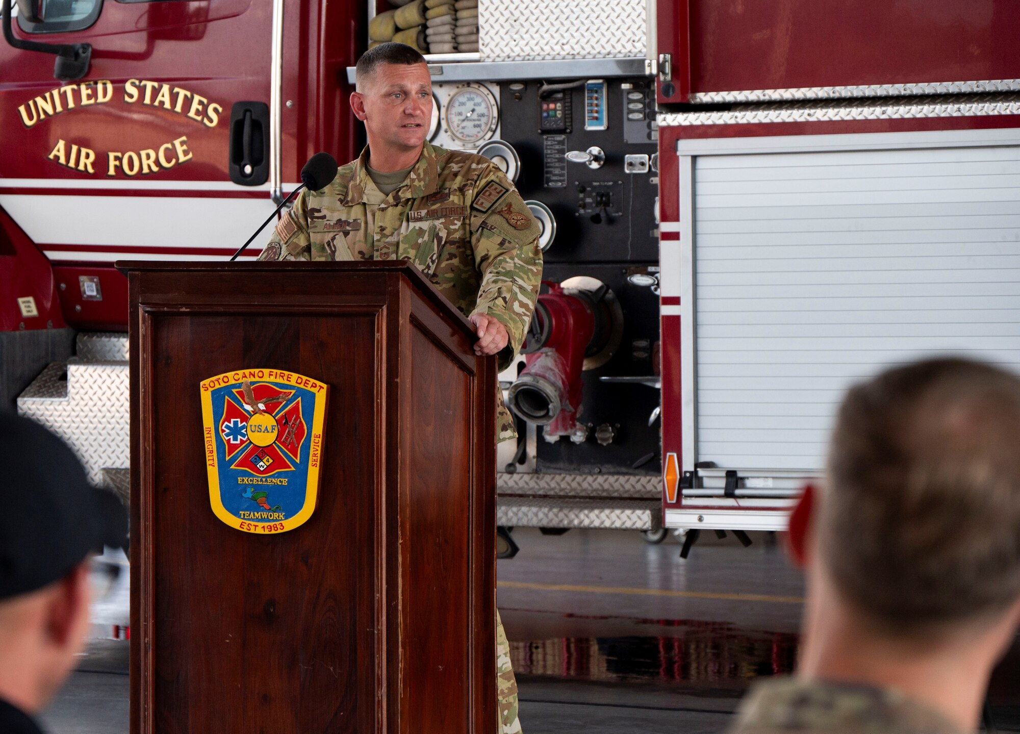 A photo of a service member giving a speech.