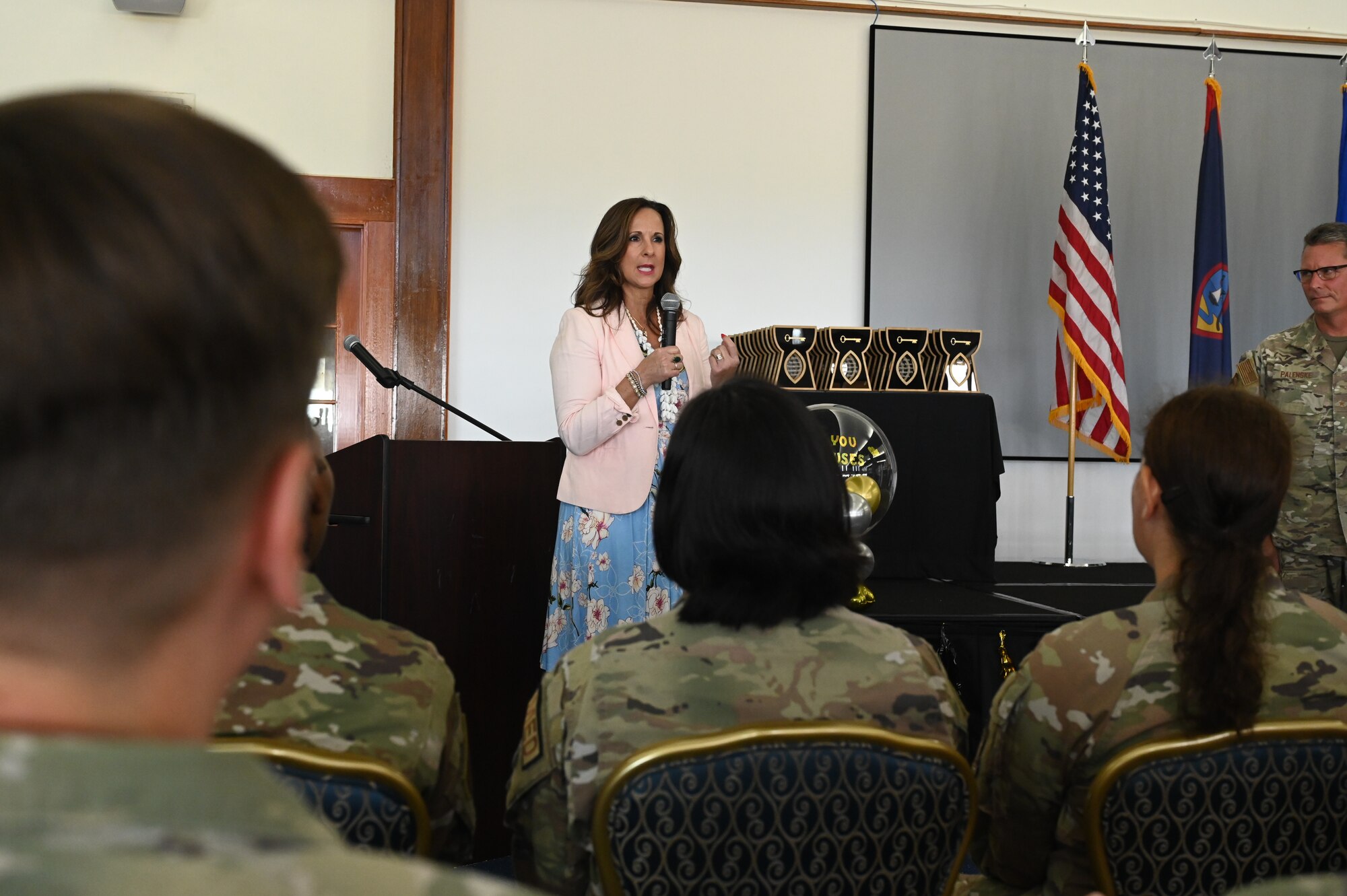 A Key Spouse mentor speaks to the audience about the importance of the Key Spouse program and how it is important to the 36th Wing