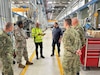 Marco Gragnani, a supervisory maintenance operations specialist and an Italian local national employee with Army Field Support Battalion-Africa (third from left), provides a few soldier maintainers from the Croatian army a tour of one of AFSBn-Africa’s maintenance facilities at Leghorn Army Depot in Livorno, Italy. Soldier maintainers from Croatian army were at Leghorn April 16-20 as part of a bilateral military-to-military APS-2 maintenance exchange with AFSBn-Africa. (Photo by Maj. Duane Dumlao, AFSBn-Africa executive officer)
