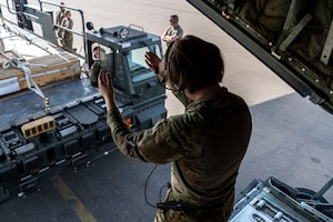 A U.S. Air Force C-130J Super Hercules loadmaster, assigned within the Central Command area of responsibility, uses hand signals help the driver of a Tunner 60K Cargo loader line up with a C-130J Super Hercules for cargo loading at an undisclosed location, April 11, 2024. The C-130J is a versatile aircraft, capable of fulfilling a wide range of operational missions throughout the region.
(U.S. Air Force photo)