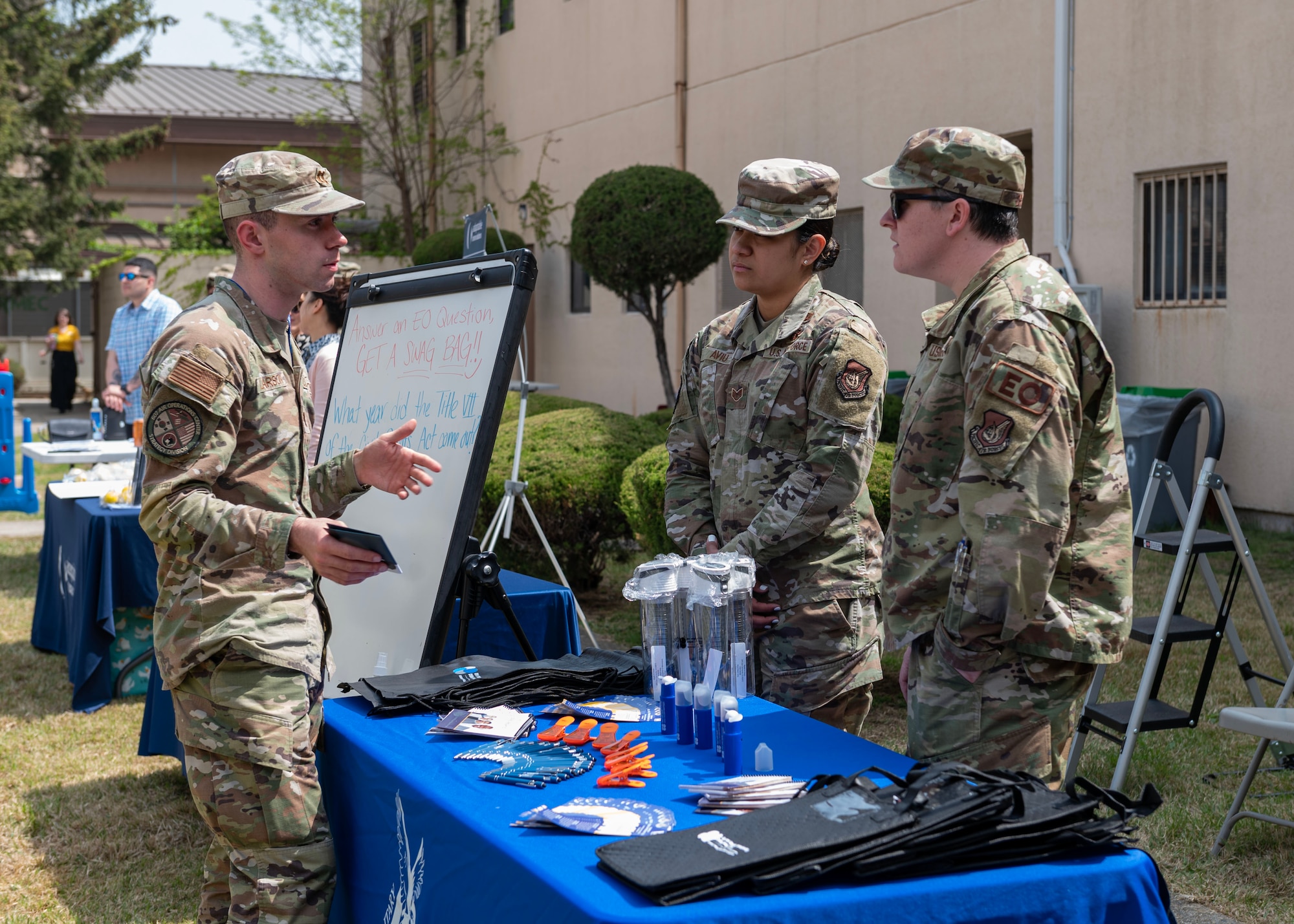 U.S. Air Force Airmen assigned to Osan Air Base, Republic of Korea, speak with one another during a Sexual Assault Awareness and Prevention Month open house event at Osan AB, ROK, April 19, 2024. Osan AB supports the SAAPM campaign year-round, and ensures that victims have appropriate outlets for care, reporting and advocacy, so Airmen can remain able to “Fight Tonight”. (U.S. Air Force photo by Staff Sgt. Aubree Owens)