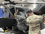 Virginia National Guard Soldiers conduct maintenance on a UH-60 Black Hawk helicopter April 2, 2024, at the Army Aviation Support Facility in Sandston, Virginia. The Soldiers are part of the AASF’s avionics shop, which troubleshoots, diagnoses and repairs avionic components and wiring on the VNG’s Black Hawk fleet.