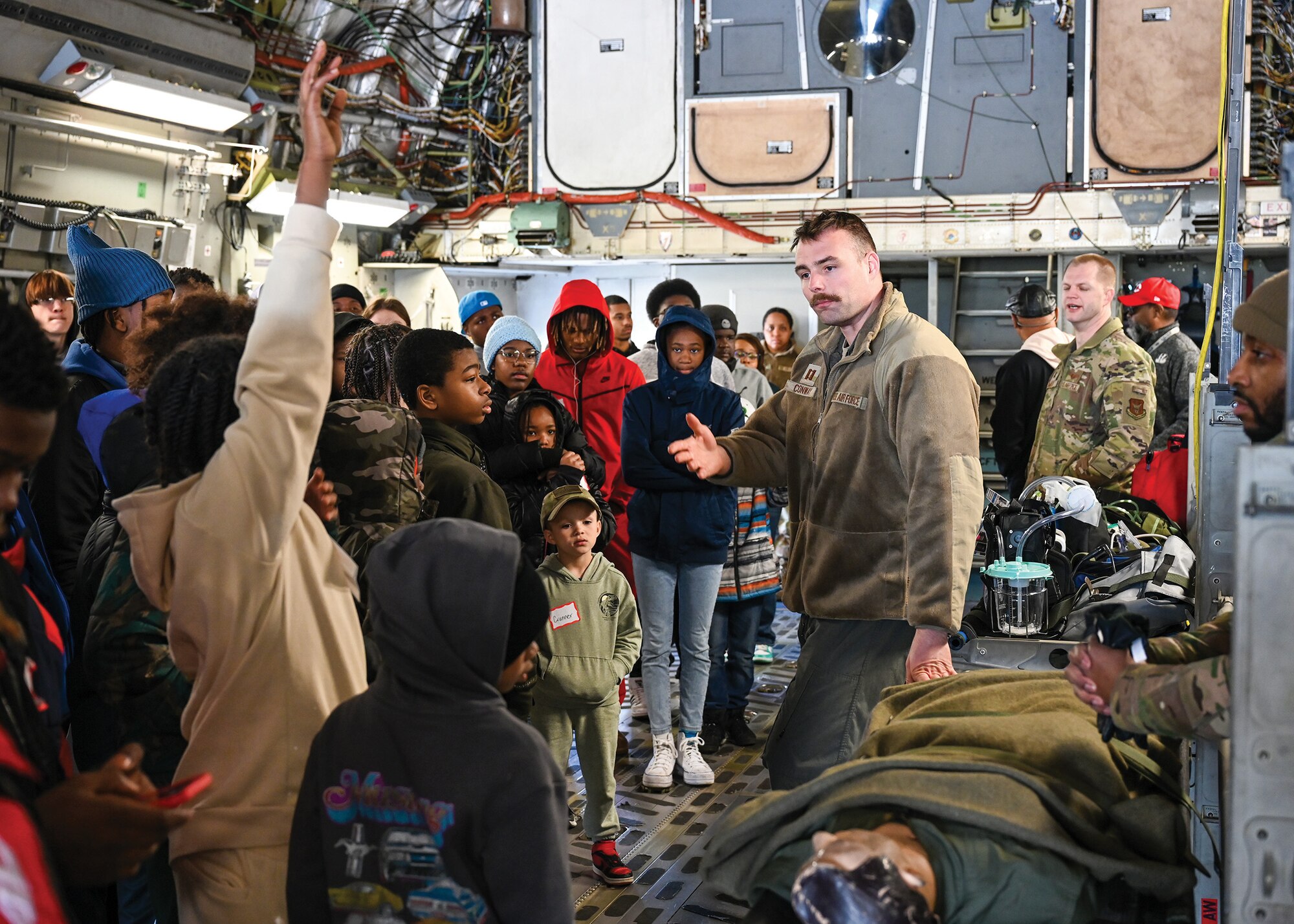 Capt. Sean Conway, 89th Airlift Squadron pilot, explains the capabilities of a C-17 Globemaster III to young members of Cincinnati-based nonprofit organization Black Boys in Tech at Wright-Patterson Air Force Base, Ohio, April 6, 2024. BBIT was created by mothers in Cincinnati to provide interactive STEM experiences and mentorship for their sons, desiring them to participate in one BBIT’s pilot program and continue with out-of-school STEM programming during the school year. (U.S. Air Force photo/Master Sgt. Patrick O’Reilly)
