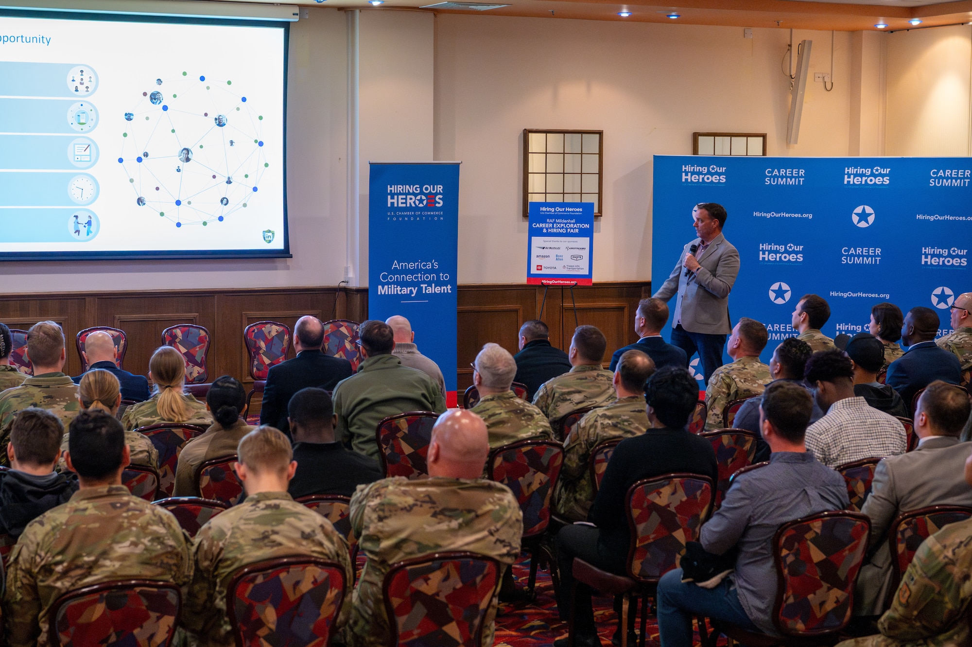 Charles Hodges, Transforces Education and Training Division president, speaks to a crowd at Royal Air Force Mildenhall, England, April 22, 2024.