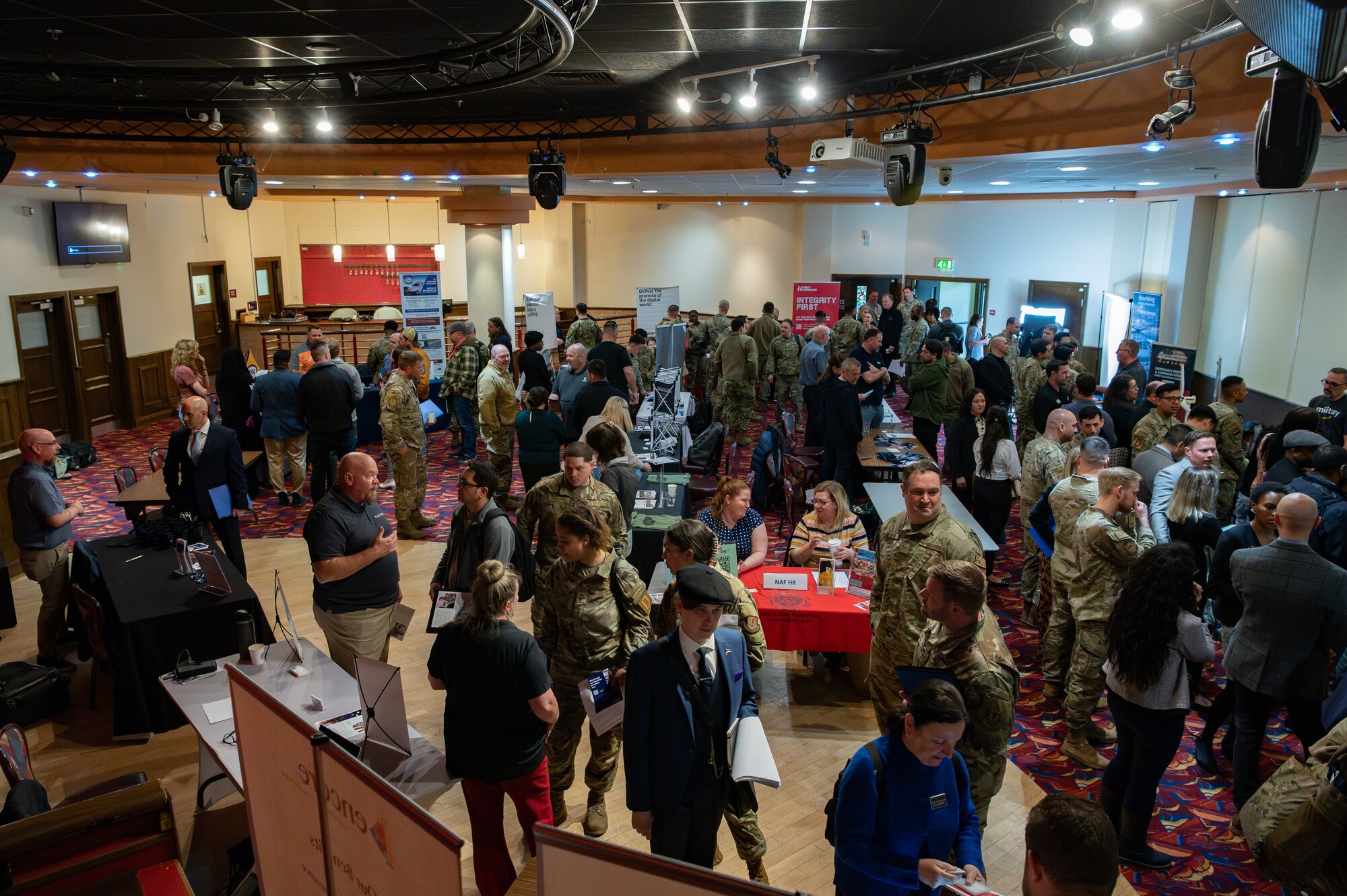 Members of the tri-base area interact with various industry representatives to learn more about different careers during the Hiring Our Heroes career fair at Royal Air Force Mildenhall, England, April 22, 2024.