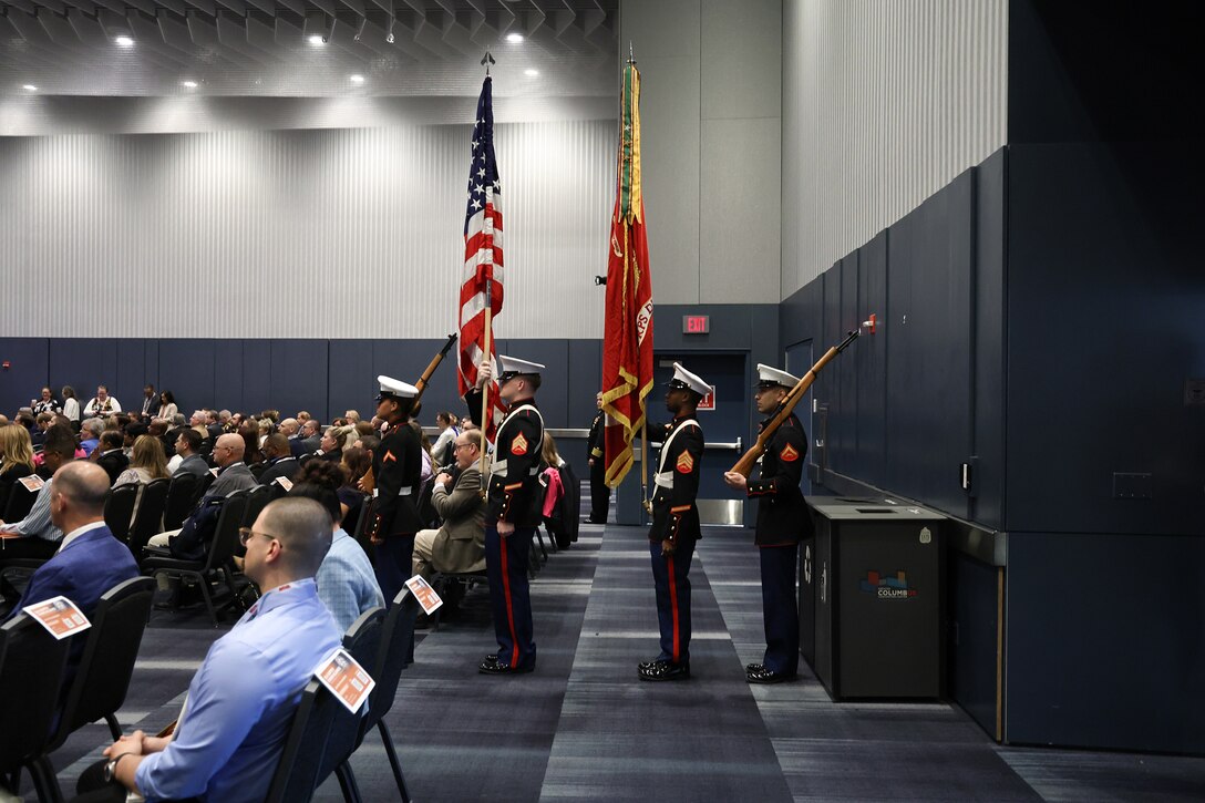 A Marine Corps Color Guard marches.