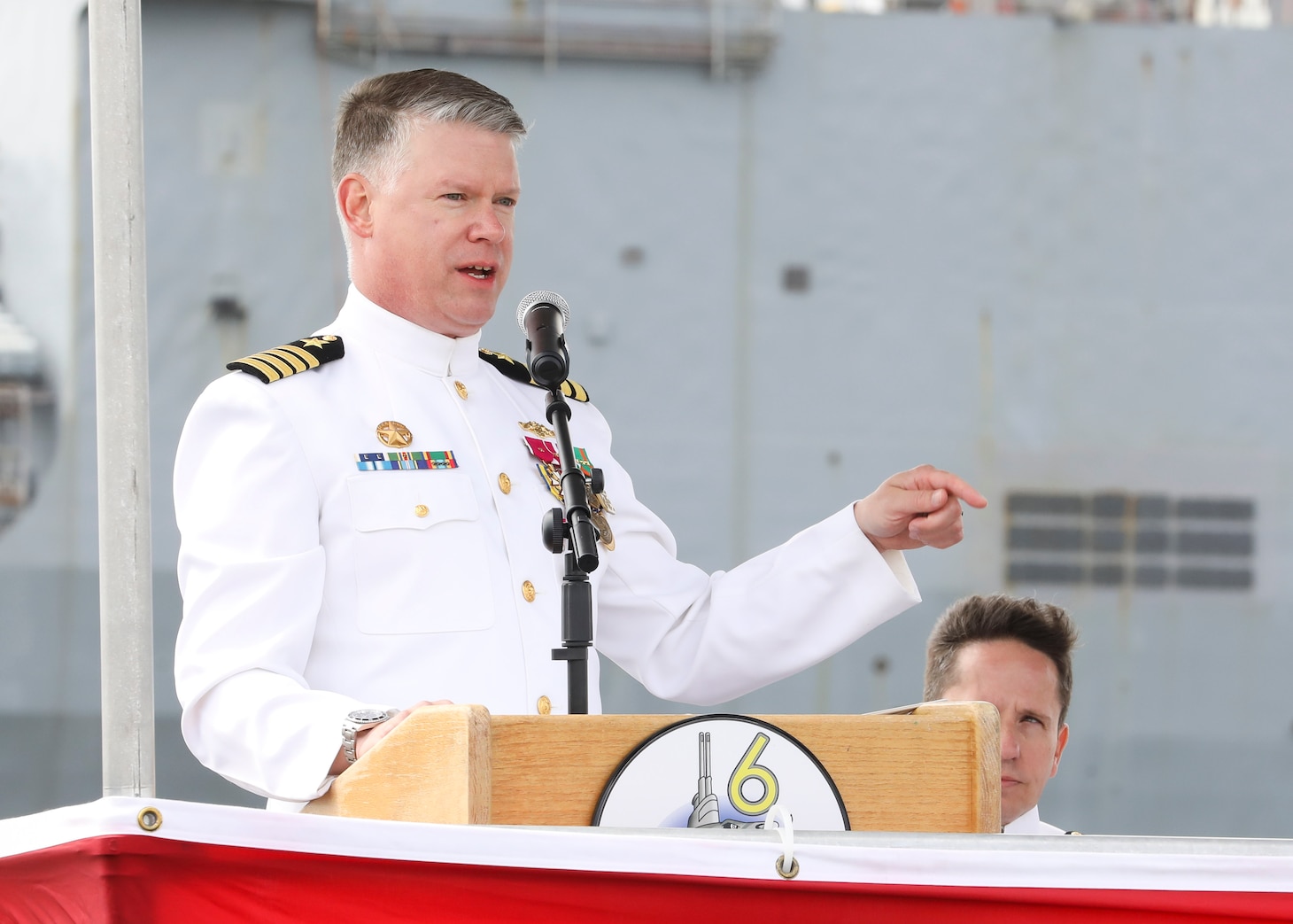 Capt. Jason Pittman, commodore, Submarine Squadron (CSS) SIX, delivers remarks during the Commander, Submarine Squadron (CSS) SIX change of command ceremony aboard the Los-Angeles class attack submarine USS Helena (SSN 725), April 25.