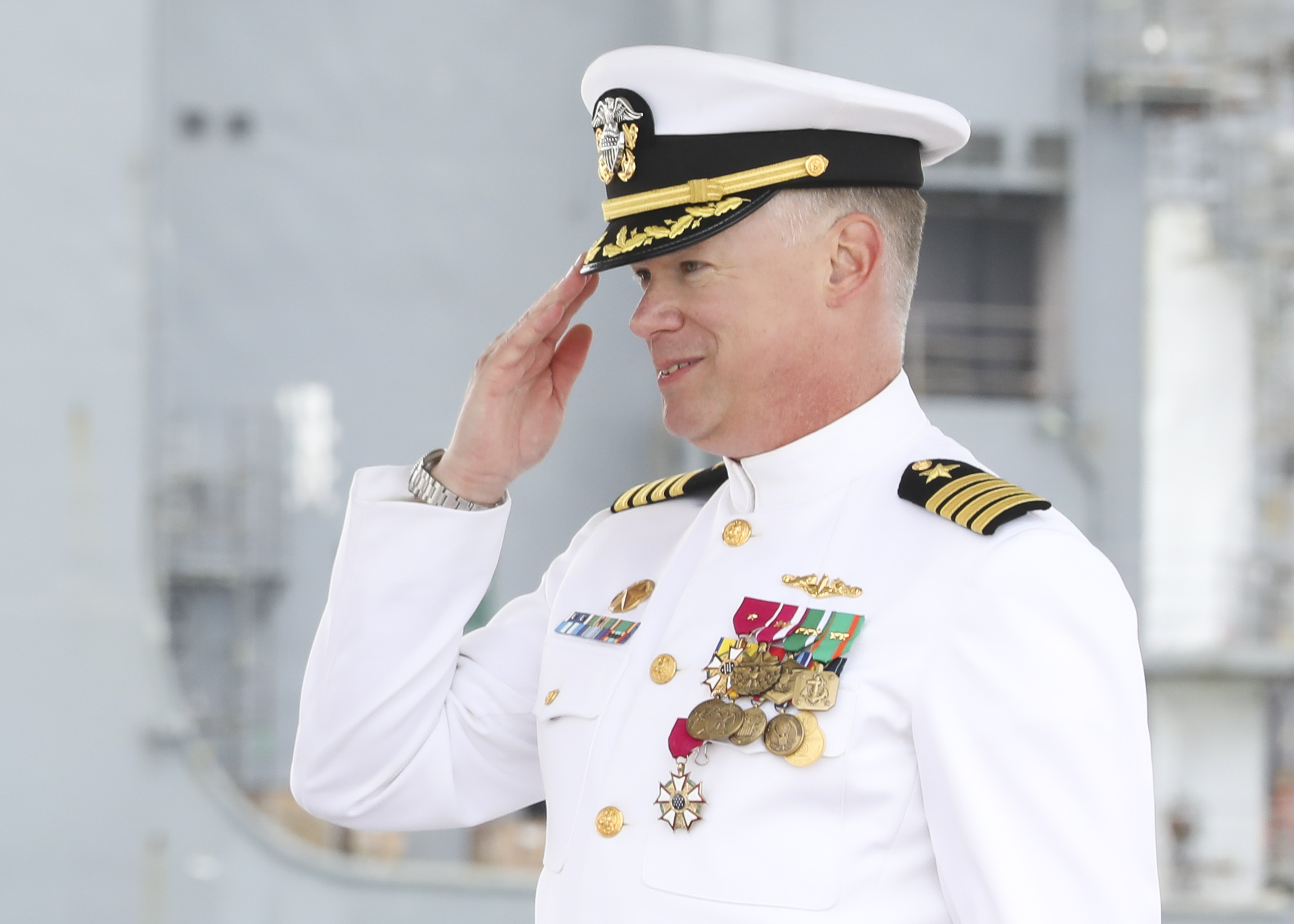 Capt. Jason Pittman renders a salute during the Commander, Submarine Squadron (CSS) SIX change of command ceremony aboard the Los-Angeles class attack submarine USS Helena (SSN 725), April 25.