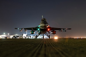 A U.S. Air Force F-16 Fighting Falcon is positioned on the flight line at an undisclosed location, U.S. Central Command Area of Responsibility, April 13, 2024. The USAF is globally postured to protect and defend freedom of coalition allies and regional partners within the CENTCOM area of responsibility to maintain peace and stability across the region. (U.S. Air Force photo)