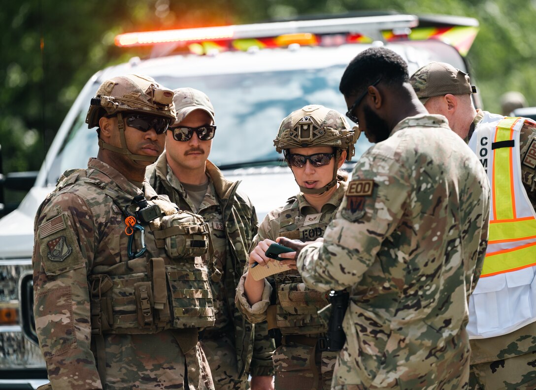 Four men and one women plan for an exercise