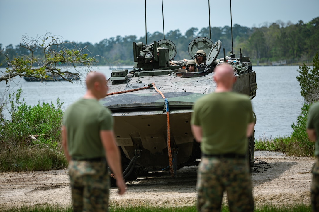 U.S. Marines with Marine Corps Systems Command and 2nd Amphibious Assault Battalion, 2nd Marine Division, observe an Amphibious Combat Vehicle (ACV) during a simulated ACV retrieval exercise at Courthouse Bay on Marine Corps Base (MCB) Camp Lejeune, North Carolina, April 17, 2024. The ACV, the Marine Corps’ latest replacement of the assault amphibious vehicle, was tested aboard MCB Camp Lejeune in order to evaluate its functionality and effectiveness in amphibious operations. (U.S. Marine Corps Photo by Cpl. Jorge Borjas)
