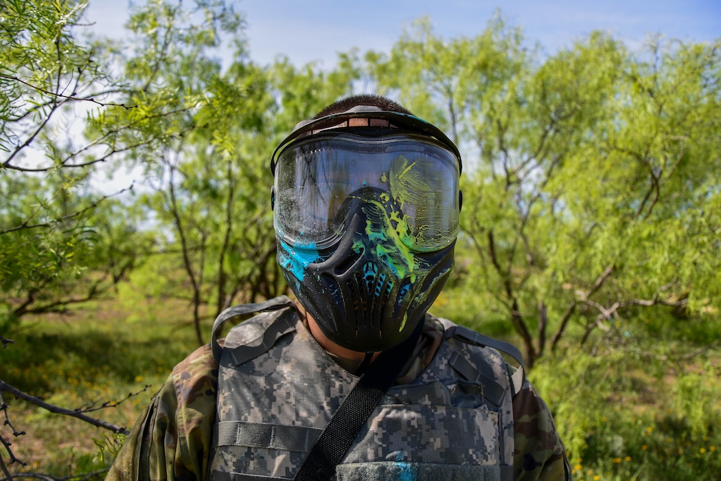 U.S. Army student volunteer poses for a photo after being hit by a paintball to the face, Goodfellow Air Force Base, Texas, April 12, 2024. During the simulated field operation portion of the Expeditionary Readiness Training course, students face off against an opposing force sourced from the tenant commands stationed on Goodfellow. (U.S. Marine Corps photo by Cpl. Jessica Roeder)