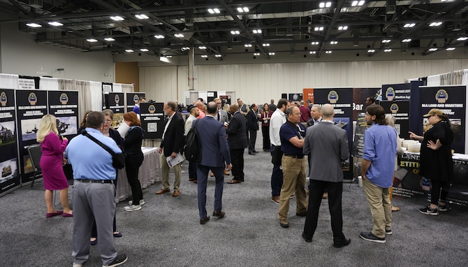Attendees visit booths at the exhibition hall April 24 during the DLA Supply Chain Alliance Conference and Exhibition at the Greater Columbus Convention Center in downtown Columbus, Ohio.