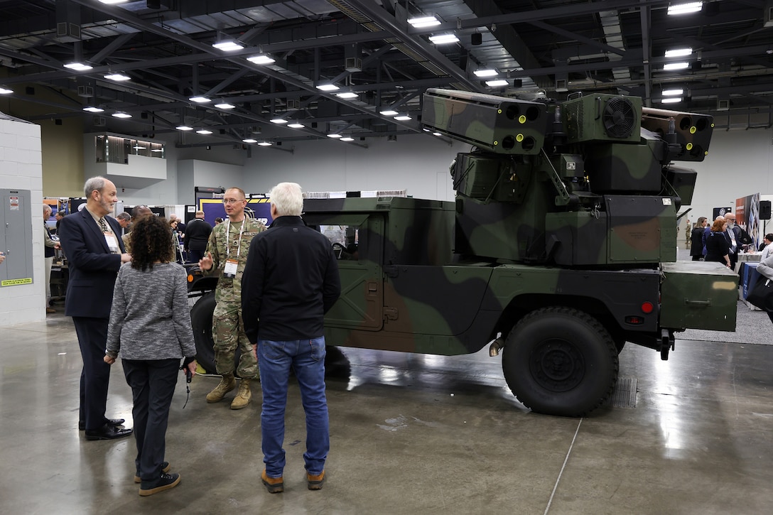 Attendees visit booths at the exhibition hall April 24 during the DLA Supply Chain Alliance Conference and Exhibition at the Greater Columbus Convention Center in downtown Columbus, Ohio.