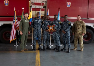 Jamaican firefighters receive the “Top Country Performers” Award for the Firefighter Challenge Obstacle Course at the CENTAM SMOKE Closing Ceremony at Soto Cano Air Base, Honduras April 26, 2024. The team averaged a time of two minutes and 43 seconds for the course, which consisted of techniques and procedures on hose advancements up two stories, nozzle control, vehicle extrication, rescue operations and carrying a 150-pound mannequin.