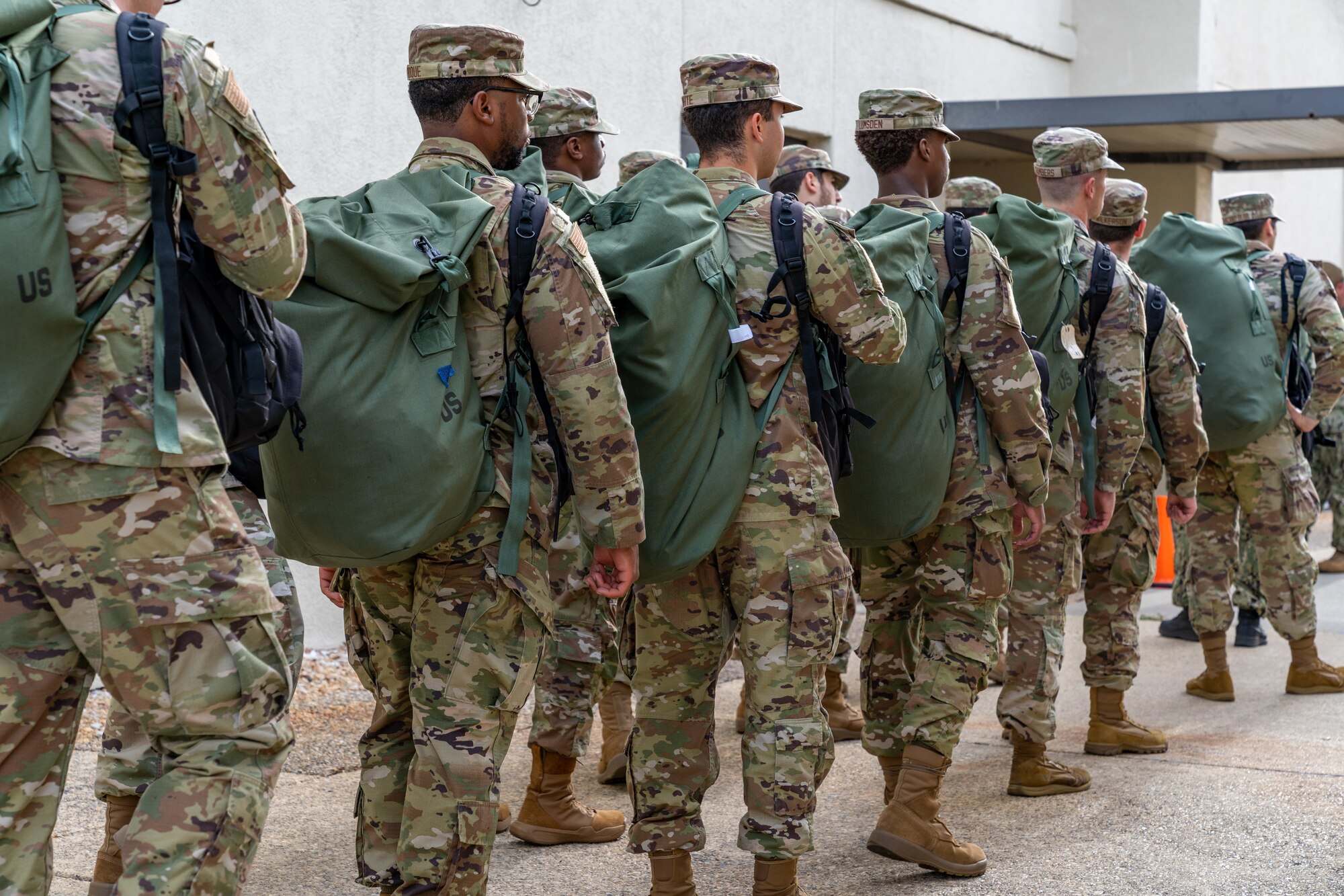 Students with the 335th Training Squadron make their way to an in-processing center at Allee Hall to shelter during a hurricane exercise at Keesler Air Force Base, Mississippi, April 26, 2024. Keesler personnel participated in exercise scenarios in preparation for hurricane season. (U.S. Air Force photo by Andrew Young)