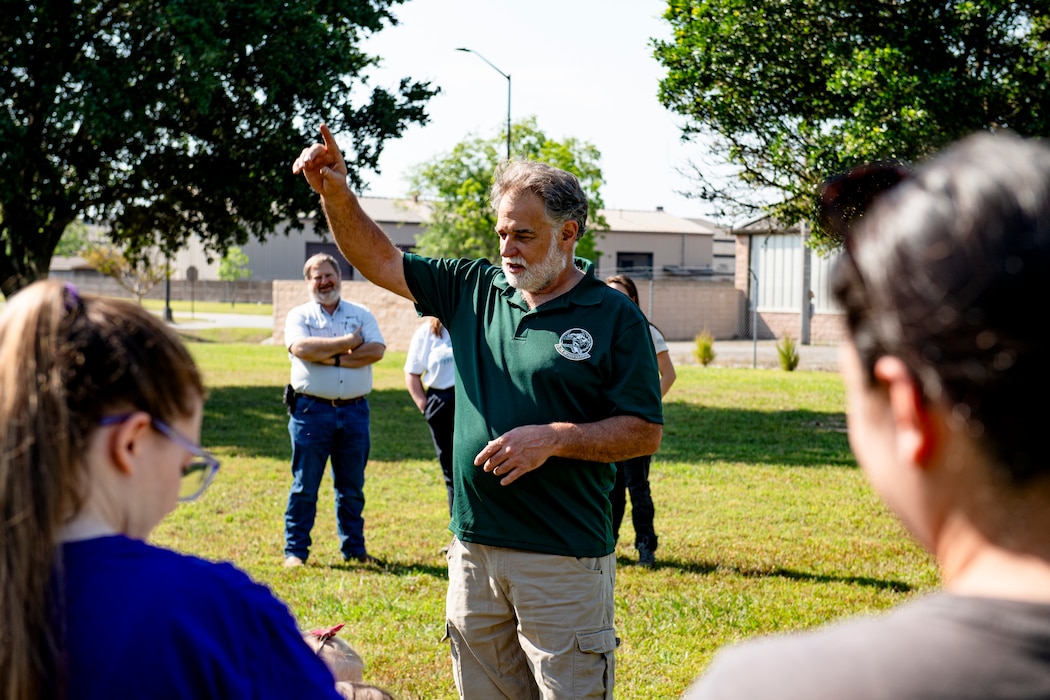 A man teaches children about Arbor Day