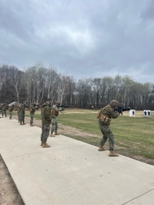 Marines from Support Company, 4th Law Enforcement Battalion, Force Headquarters Group engage targets out to 100 yards at the Camp Ripley firing range in Little Falls, Minnesota to enhance weapons proficiency.