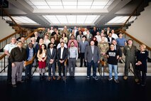 A group photo of individuals on steps.